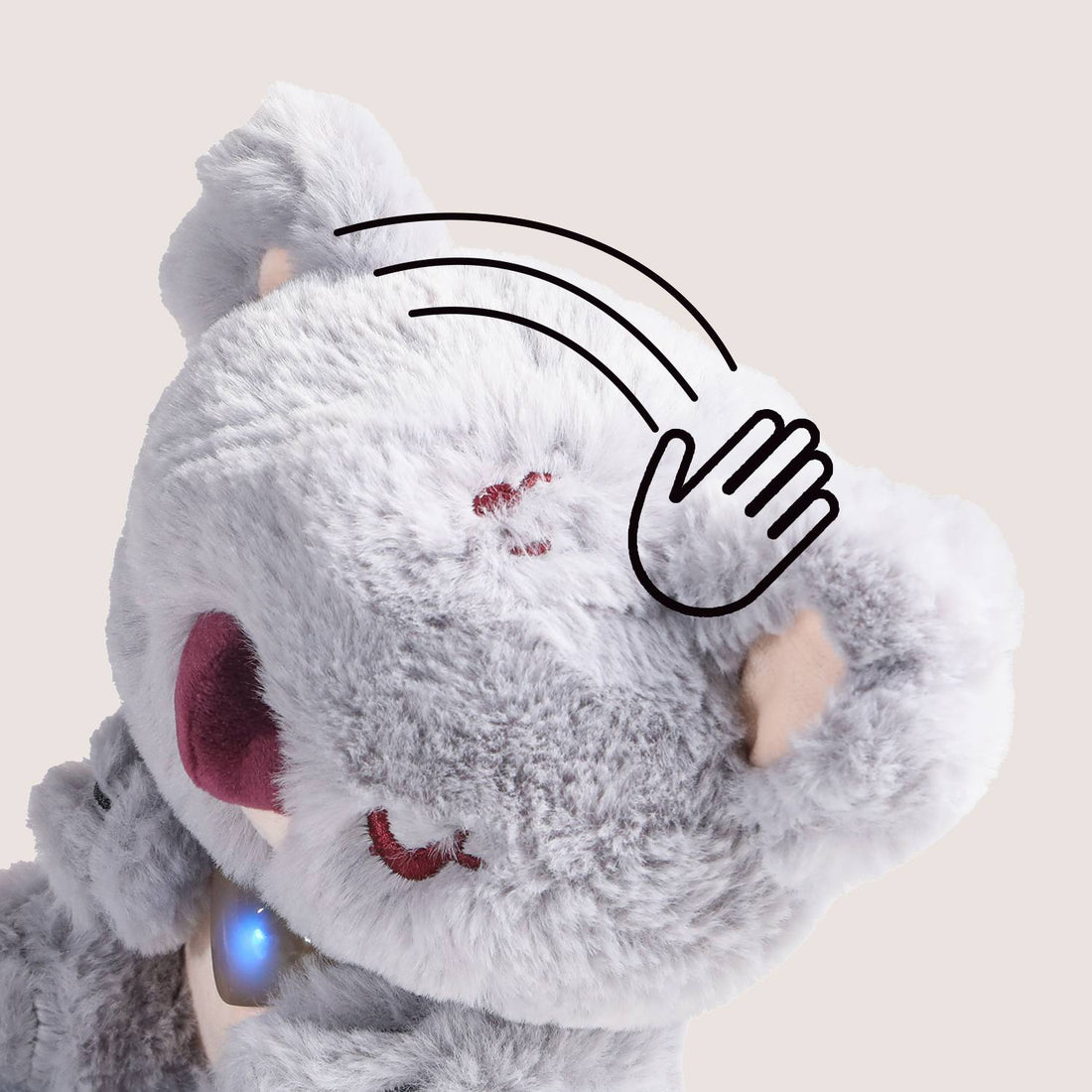 Close-up of Care Pets Baby Koala plush toy showing light-up heart that represents emotions.