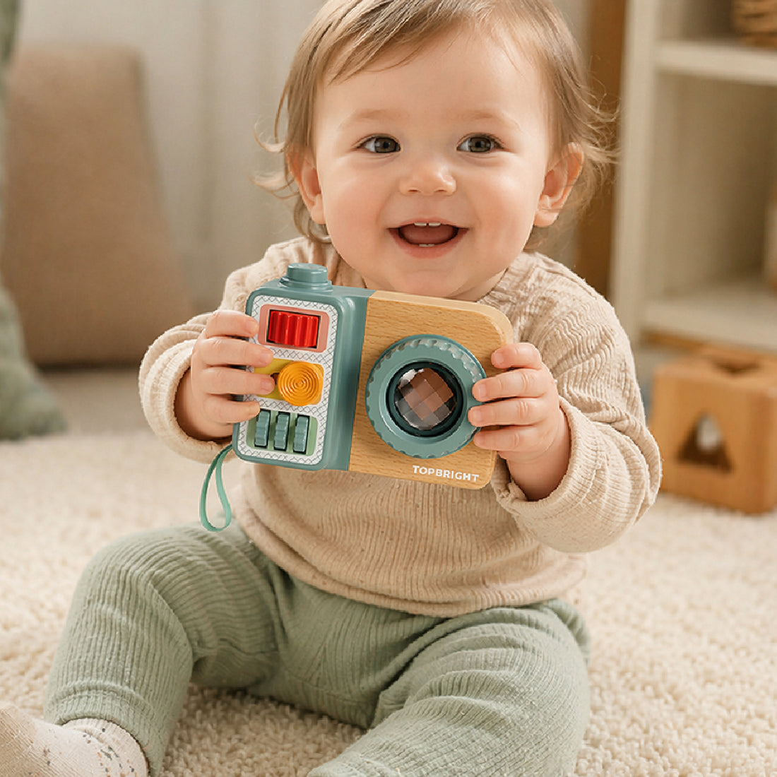 toddler playing with Busy Camera sensory toy, child using Montessori activity toy for fine motor skill development